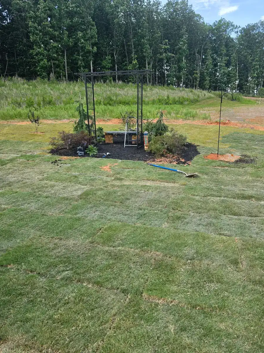 Modern paver patio with privacy screen by Lawn Firm in Concord, NC