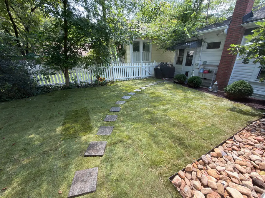 New sod lawn with a stepping-stone path in a Concord, NC backyard
